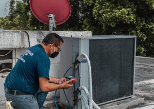 Engineer inspecting HVAC system for facility management maintenance
