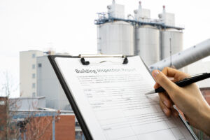 Facilities manager conducting compliance audit as part of retail facilities management UK obligations